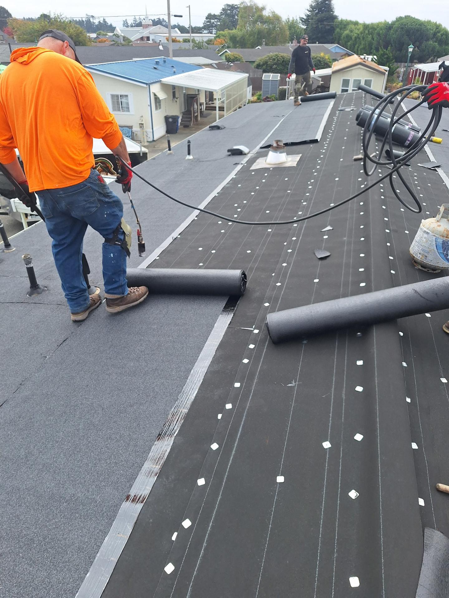 Installation — Seams and edges are sealed and fastened for a weather-tight finish.