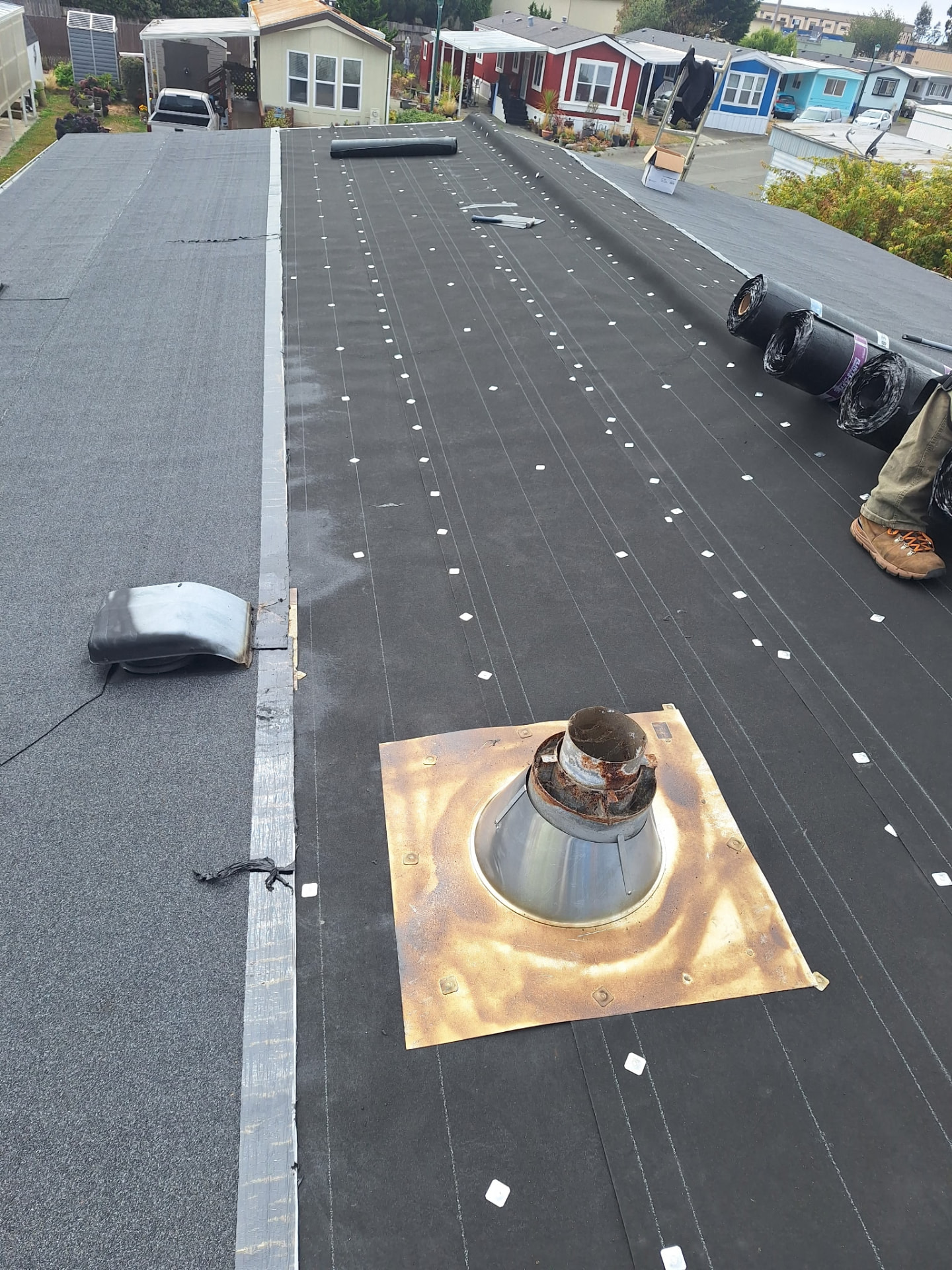 Underlayment — A weatherproof barrier is fastened across the deck.